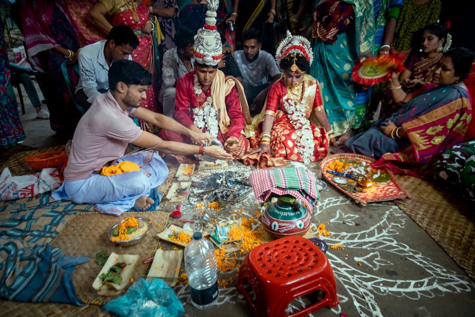 People Wearing Colourful Traditional Clothing Participating in a Ritual